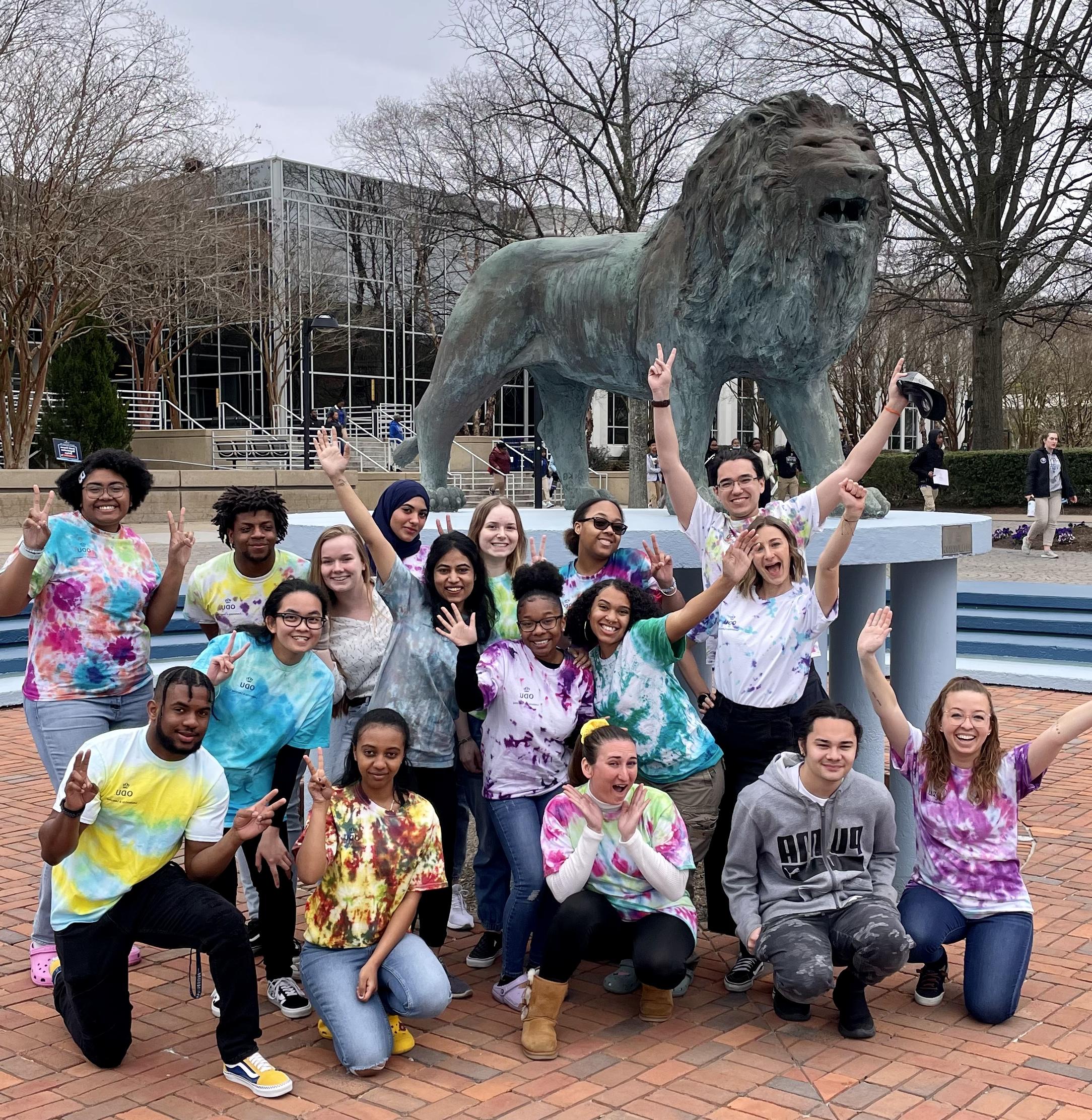asb students in front of lion statue