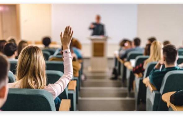Student raising her hand in ODU class
