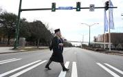Graduate crosses Hampton Boulevard