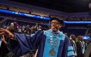 President Brian O. Hemphill, Ph.D., waves to students as he exits the the College of Arts and Letters commencement on May 6. Photo Chuck Thomas/ODU