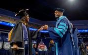 President Brian O. Hemphill, Ph.D., congratulates a student at Old Dominion University's commencement exercises on May 6 at Chartway Arena. Photo Chuck Thomas/ODU